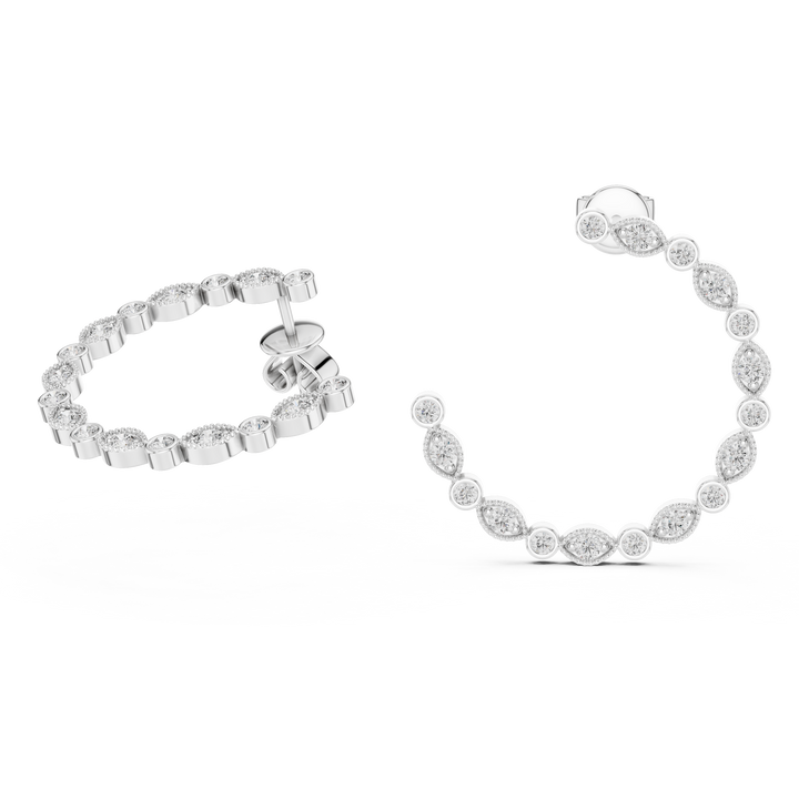 Silver bracelet and earrings on a white background