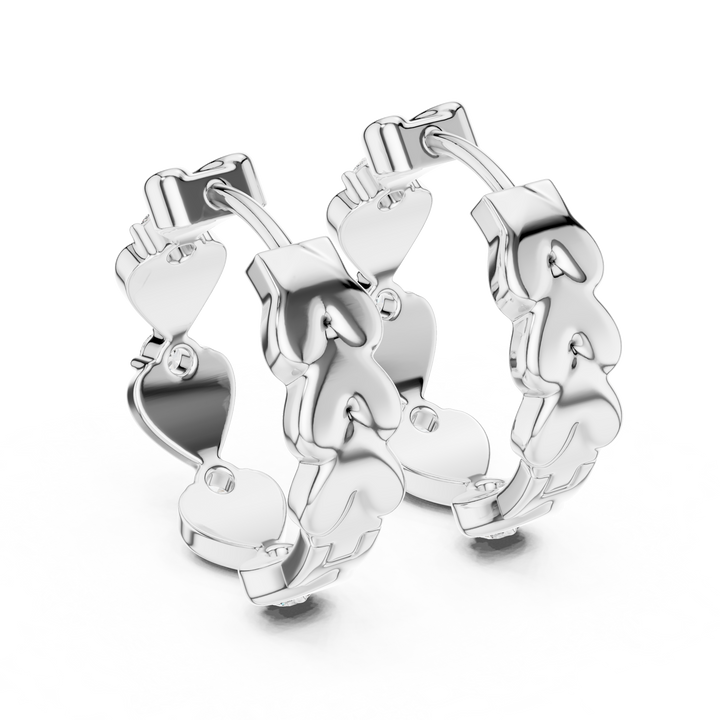 Silver hoop earrings with unique design on a white background