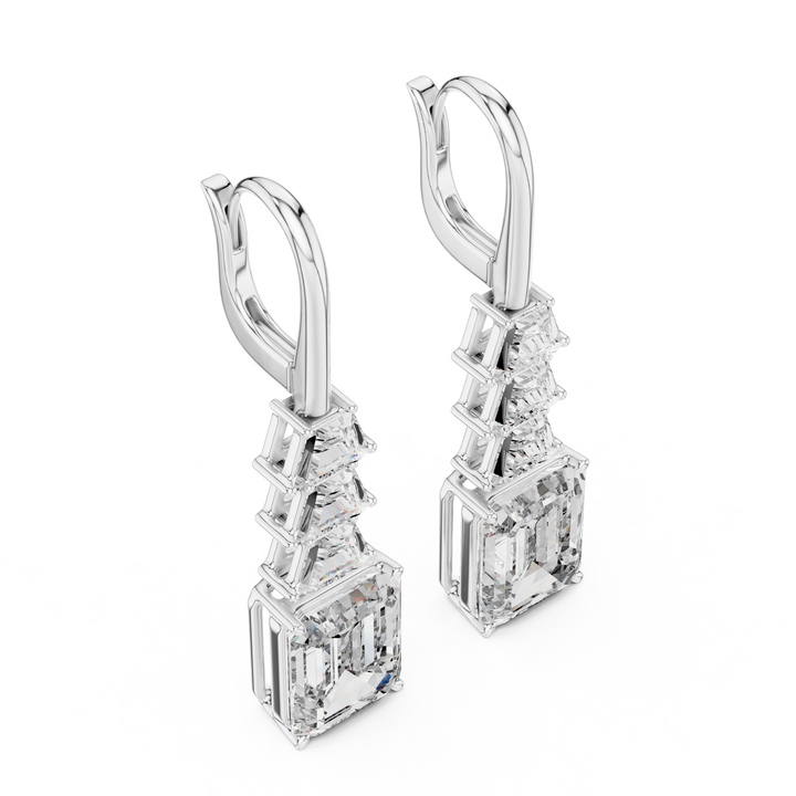 Pair of diamond earrings on a white background