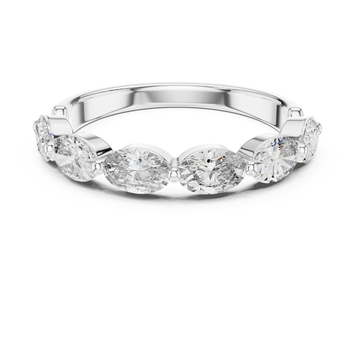 Silver ring with three clear gemstones on a white background