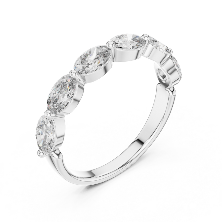 Silver ring with five diamonds on a white background