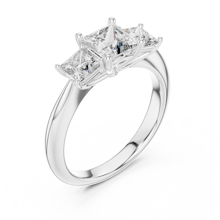 Diamond ring with three princess-cut diamonds on a white background