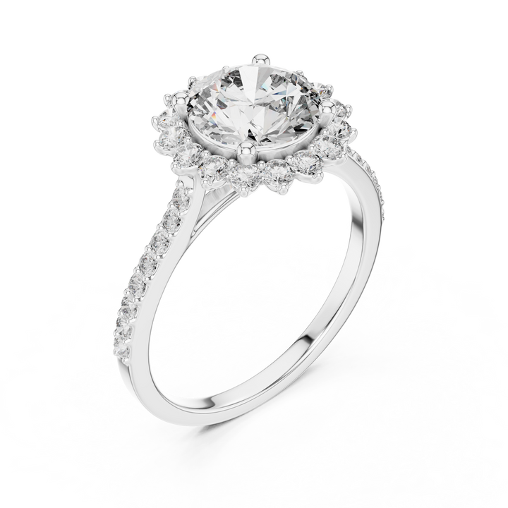 Diamond ring with a halo on a white background
