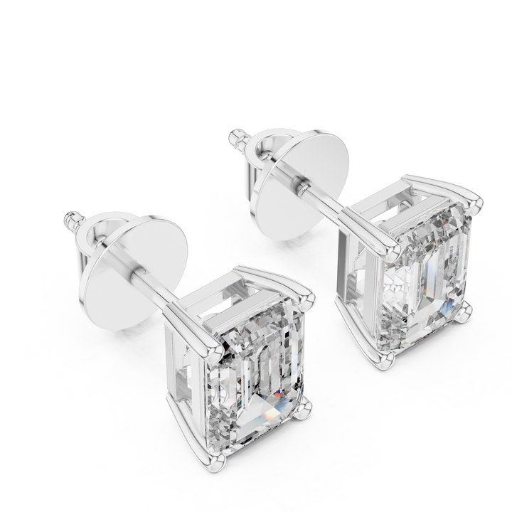 Pair of diamond stud earrings on a white background