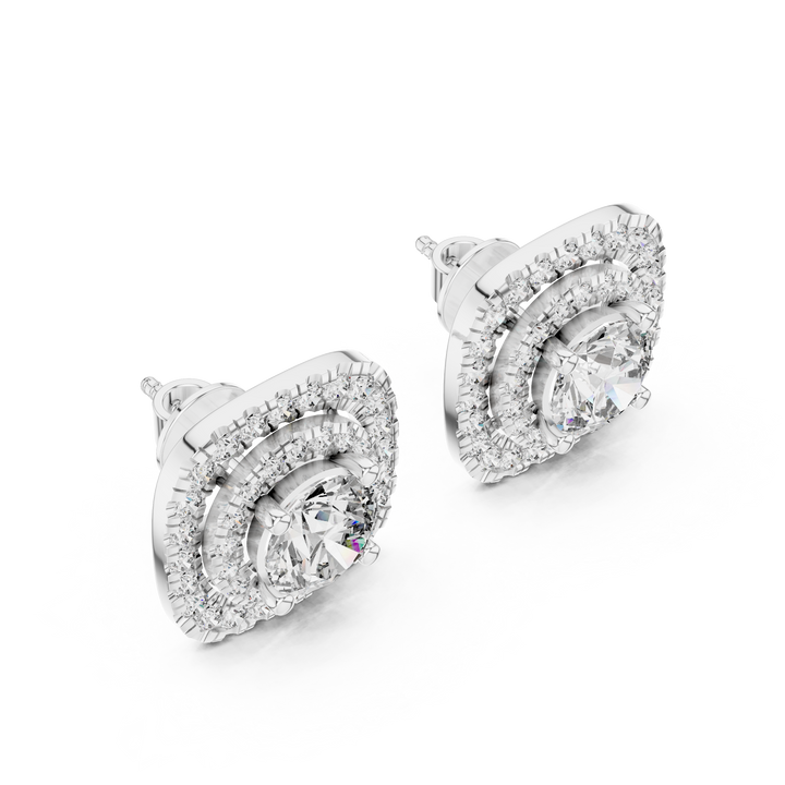 Pair of silver earrings with clear gemstones on a white background
