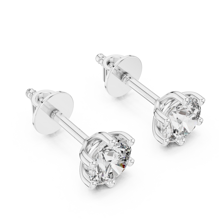 Pair of diamond stud earrings on a white background