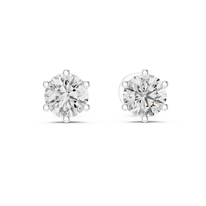 Pair of diamond stud earrings on a white background