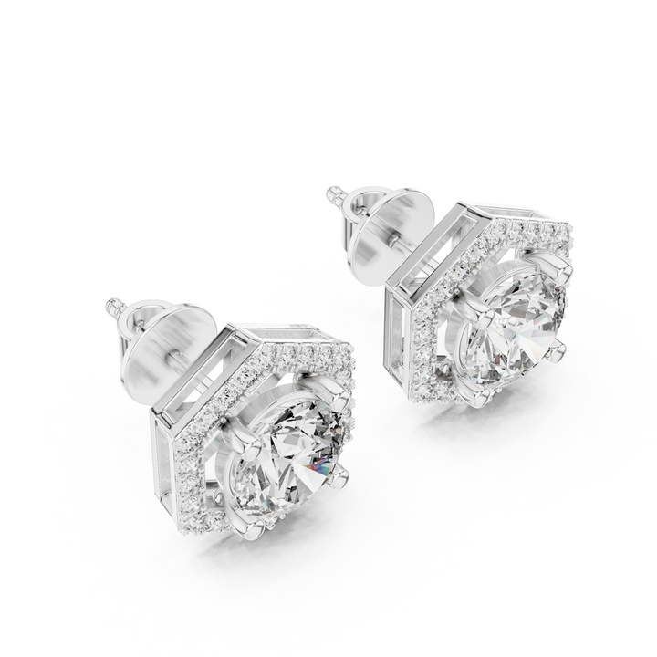 Pair of silver earrings with clear gemstones on a white background
