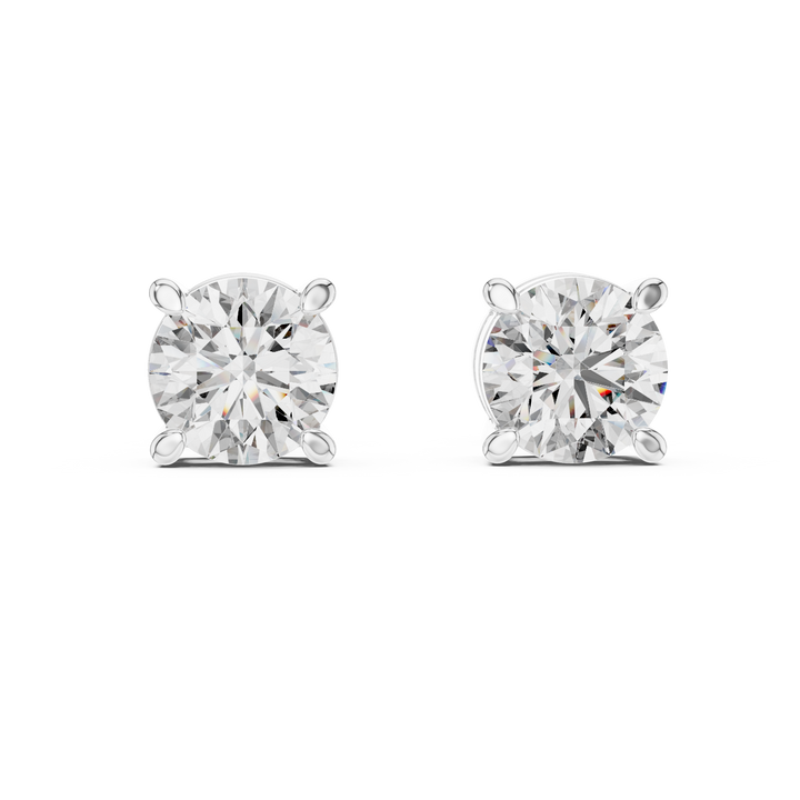 Pair of diamond stud earrings on a white background