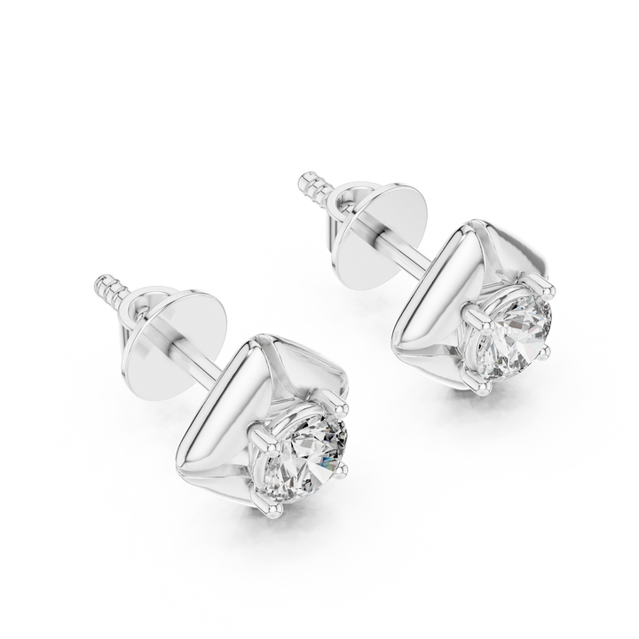 Pair of diamond stud earrings on a white background