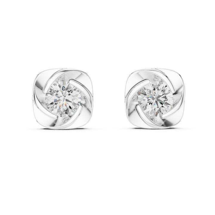 Pair of silver earrings with clear gemstones on a white background