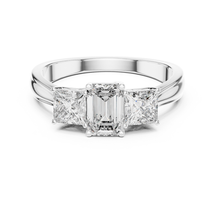 Diamond ring with a central emerald-cut diamond and two side stones on a white background