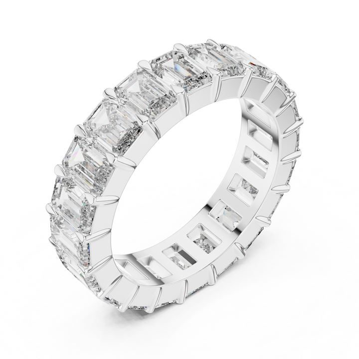 Diamond ring with baguette and round cut stones on a white background