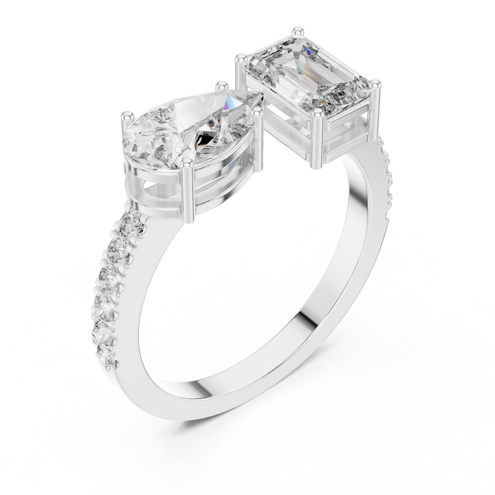 Diamond ring with two prominent gemstones on a white background