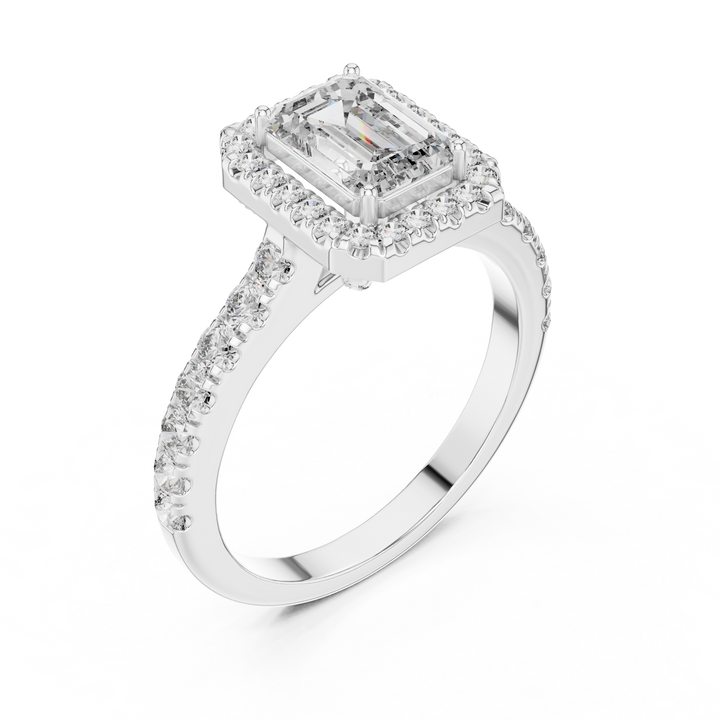 Diamond ring with a rectangular center stone on a white background
