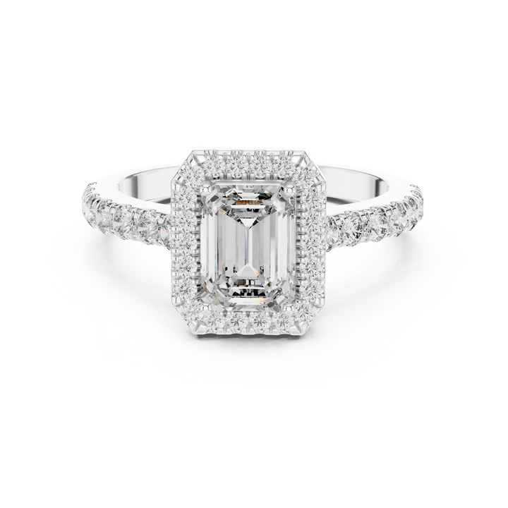 Diamond ring with a central emerald-cut gemstone and diamond accents on a white background