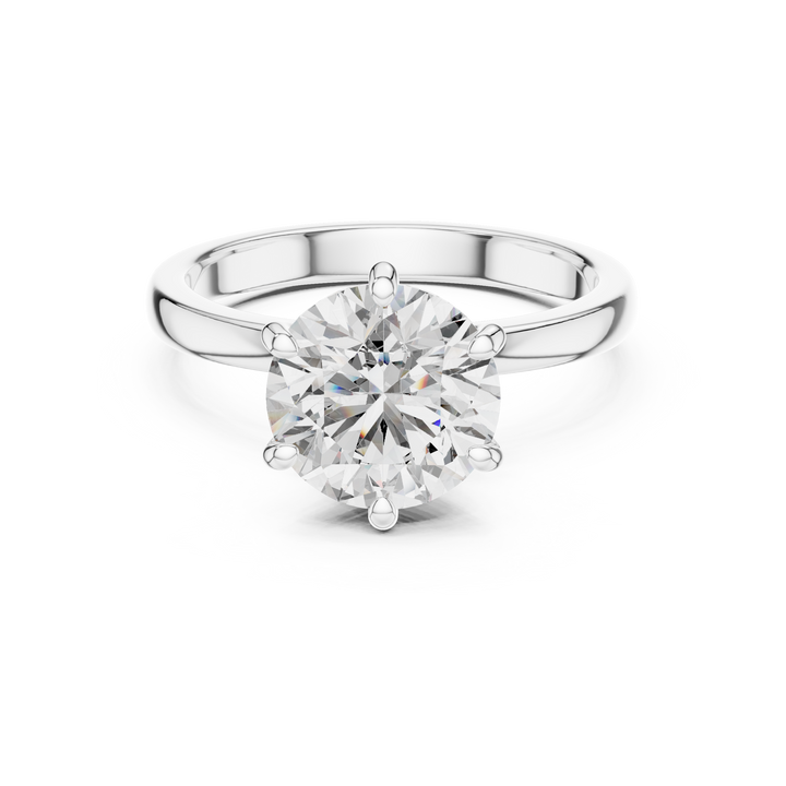 Silver ring with a large diamond on a white background