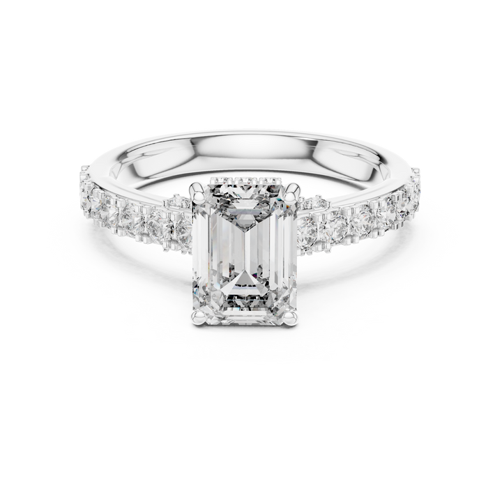 Diamond ring with a rectangular center stone on a white background