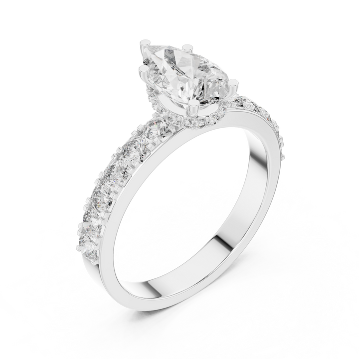 Diamond ring with a pear-shaped center stone on a white background