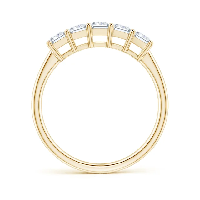 Gold ring with four diamonds on a white background
