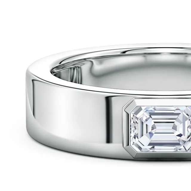 Silver ring with a diamond on a white background