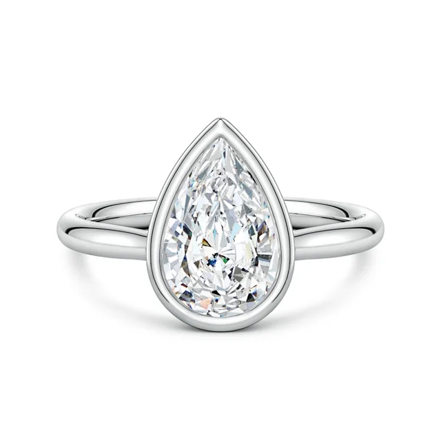 Teardrop-shaped diamond ring on a white background