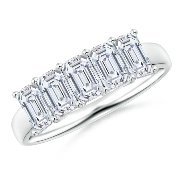 Diamond ring with emerald-cut stones on a white background