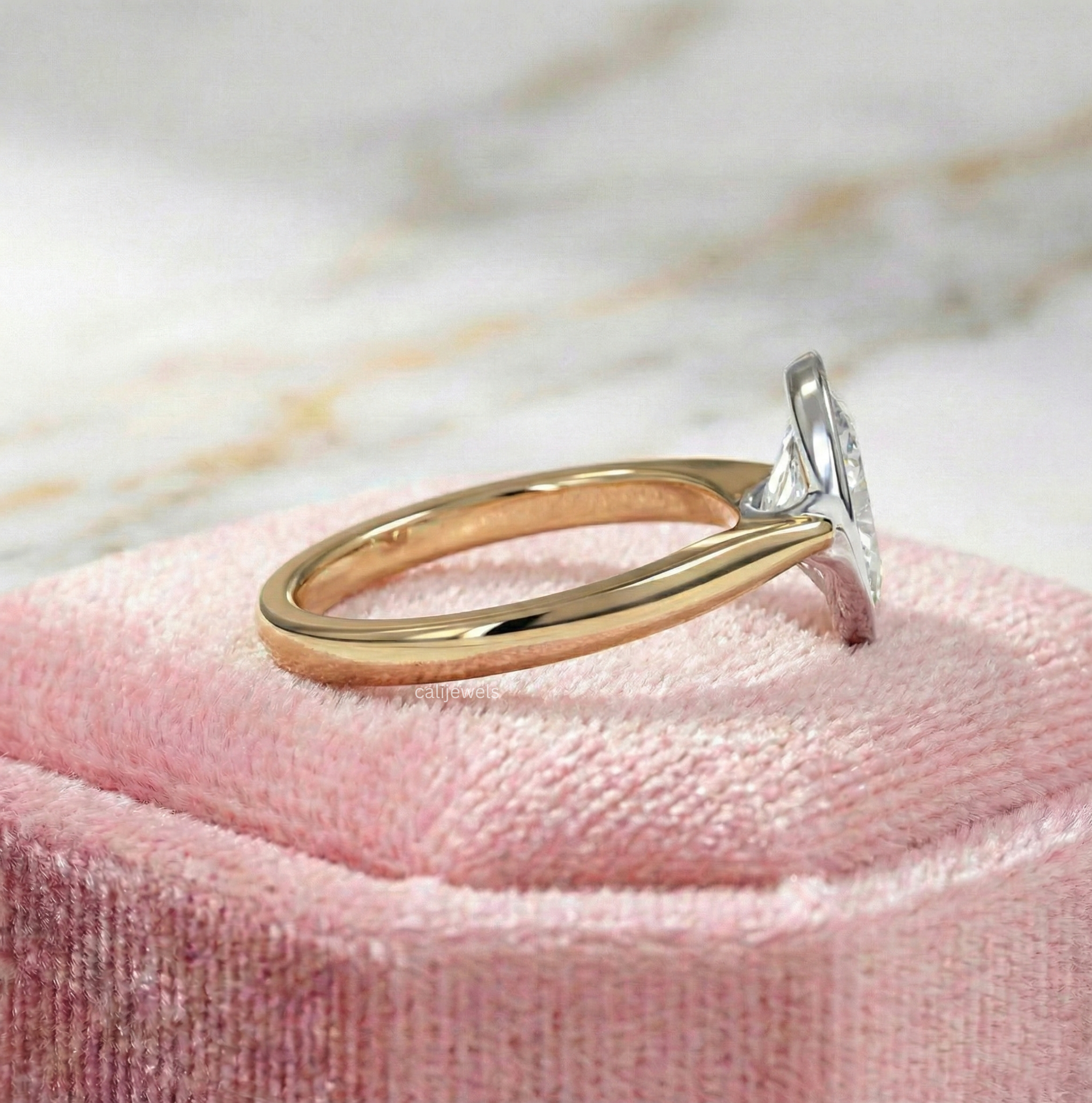 Two Tone Oval Cut Lab Grown Diamond Bezel Set Engagement Ring