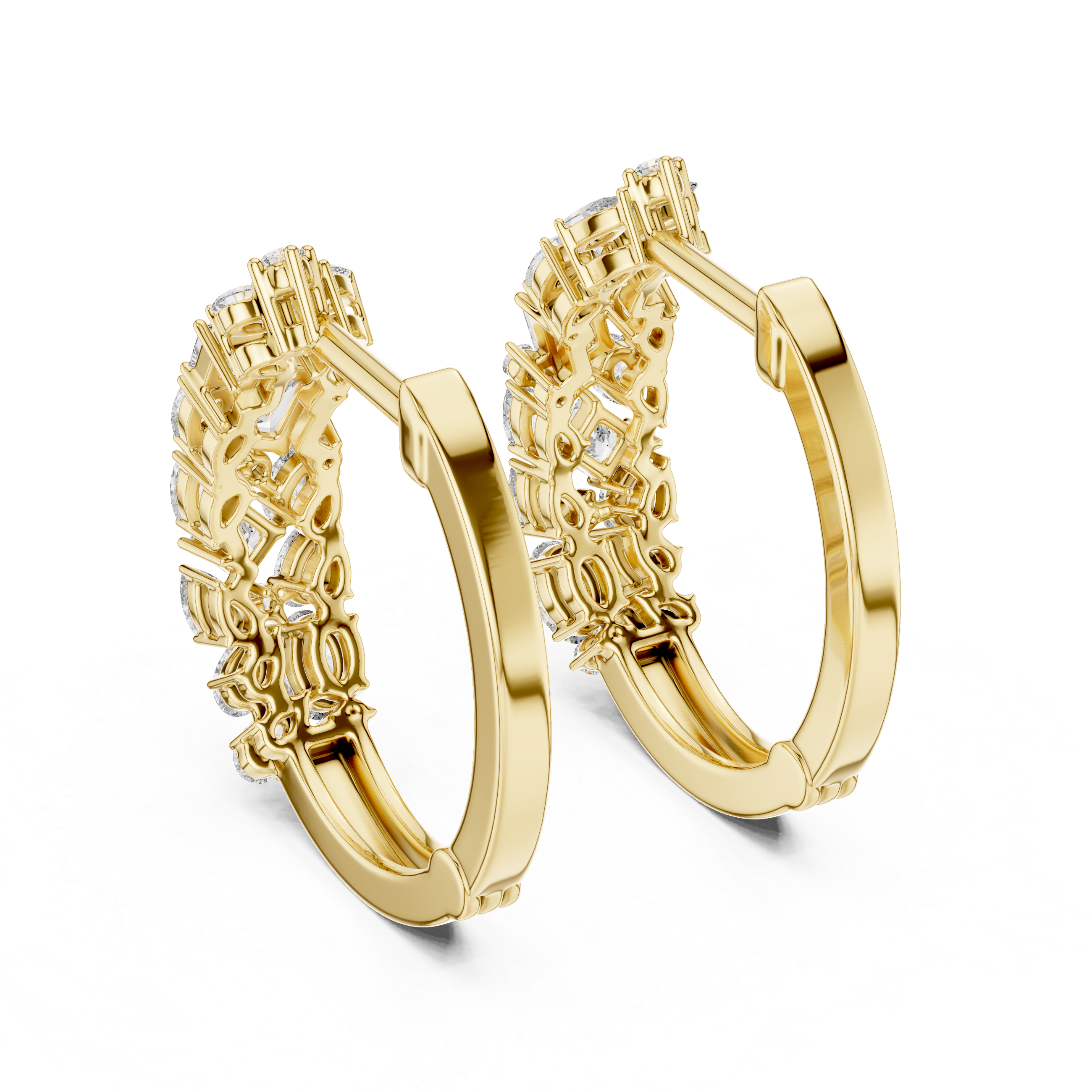 Gold hoop earrings with intricate designs on a white background