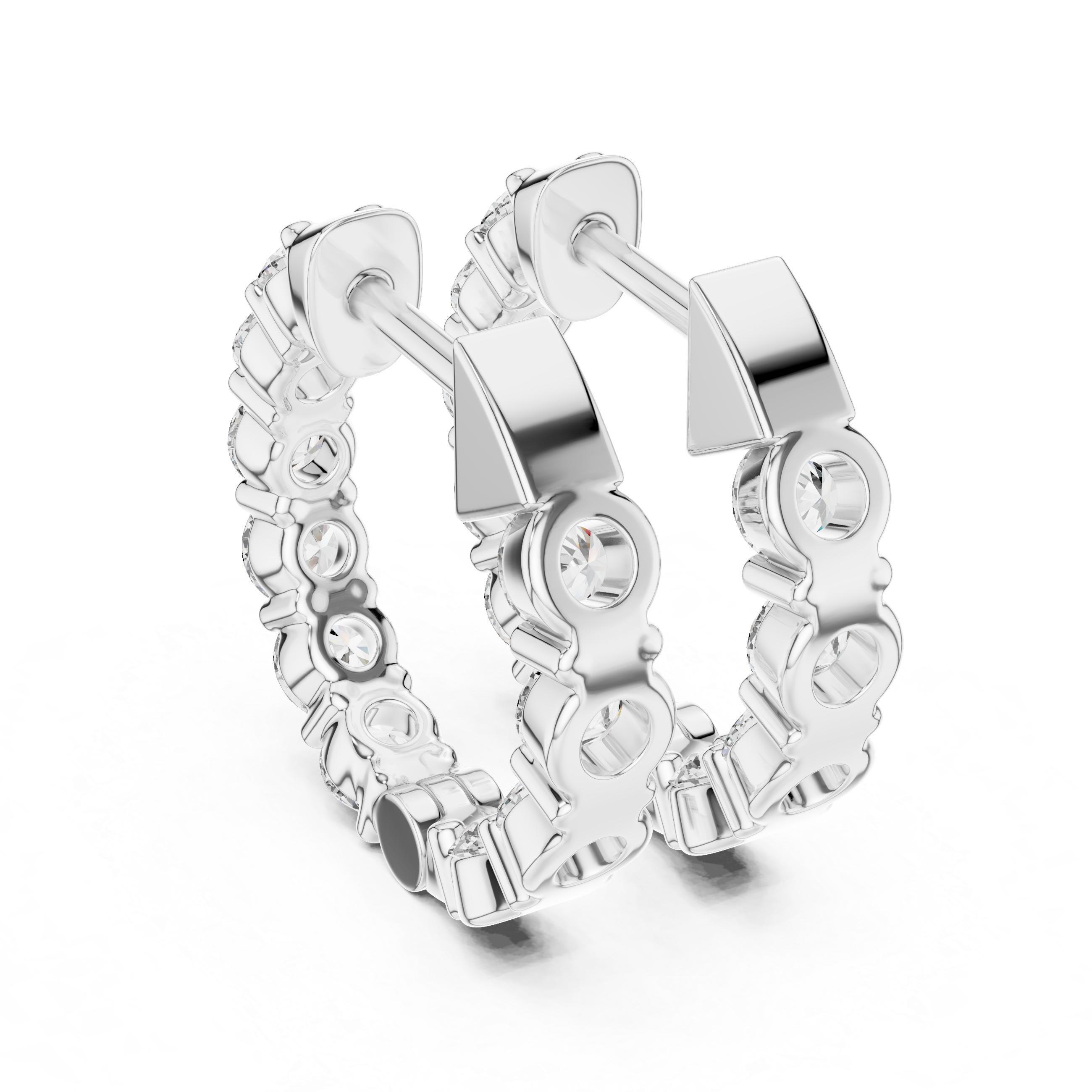 Silver hoop earrings with clear gemstones on a white background