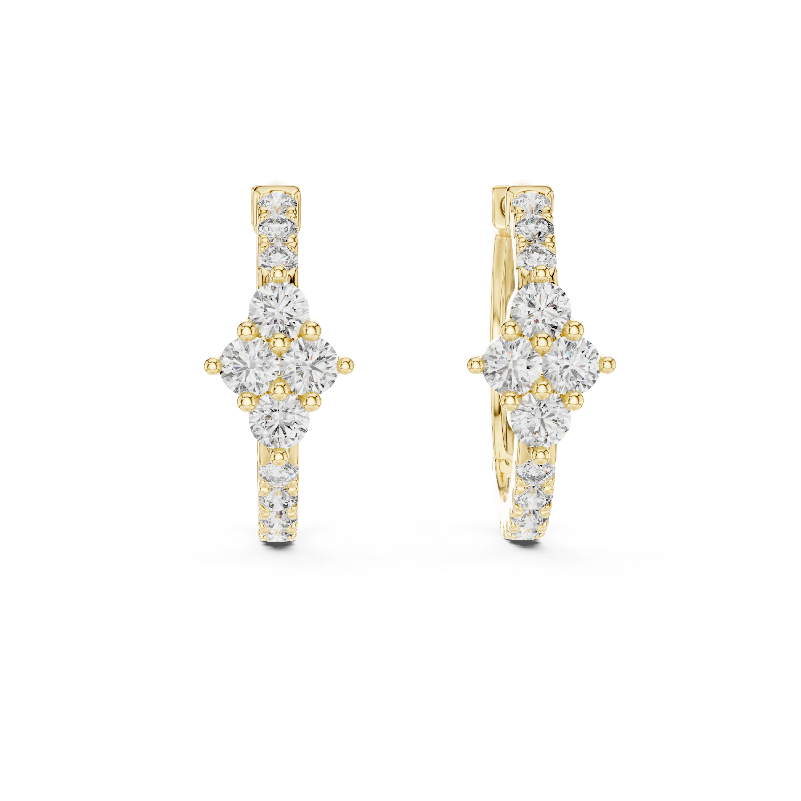 Gold and diamond earrings on a white background