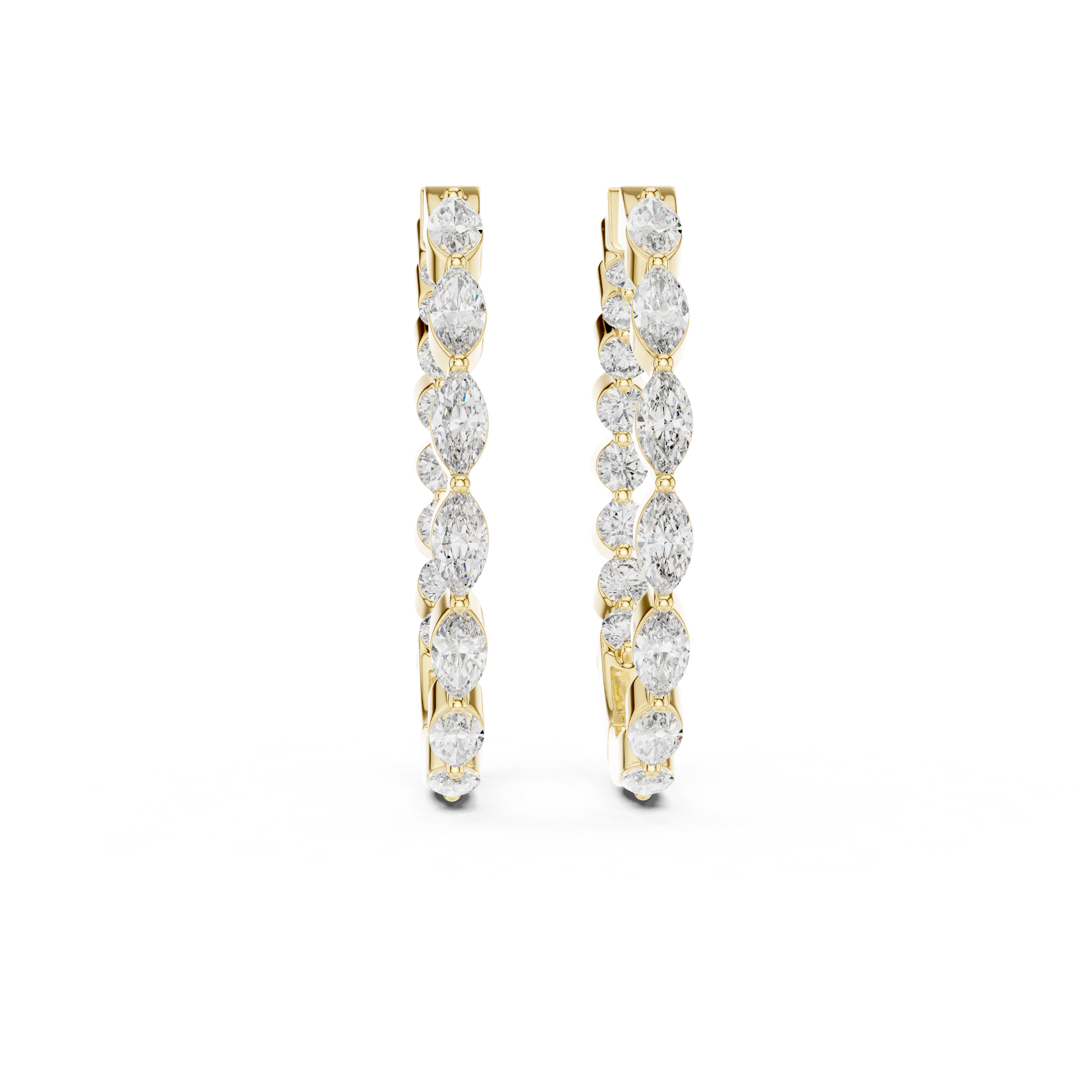 Pair of gold hoop earrings with clear gemstones on a white background