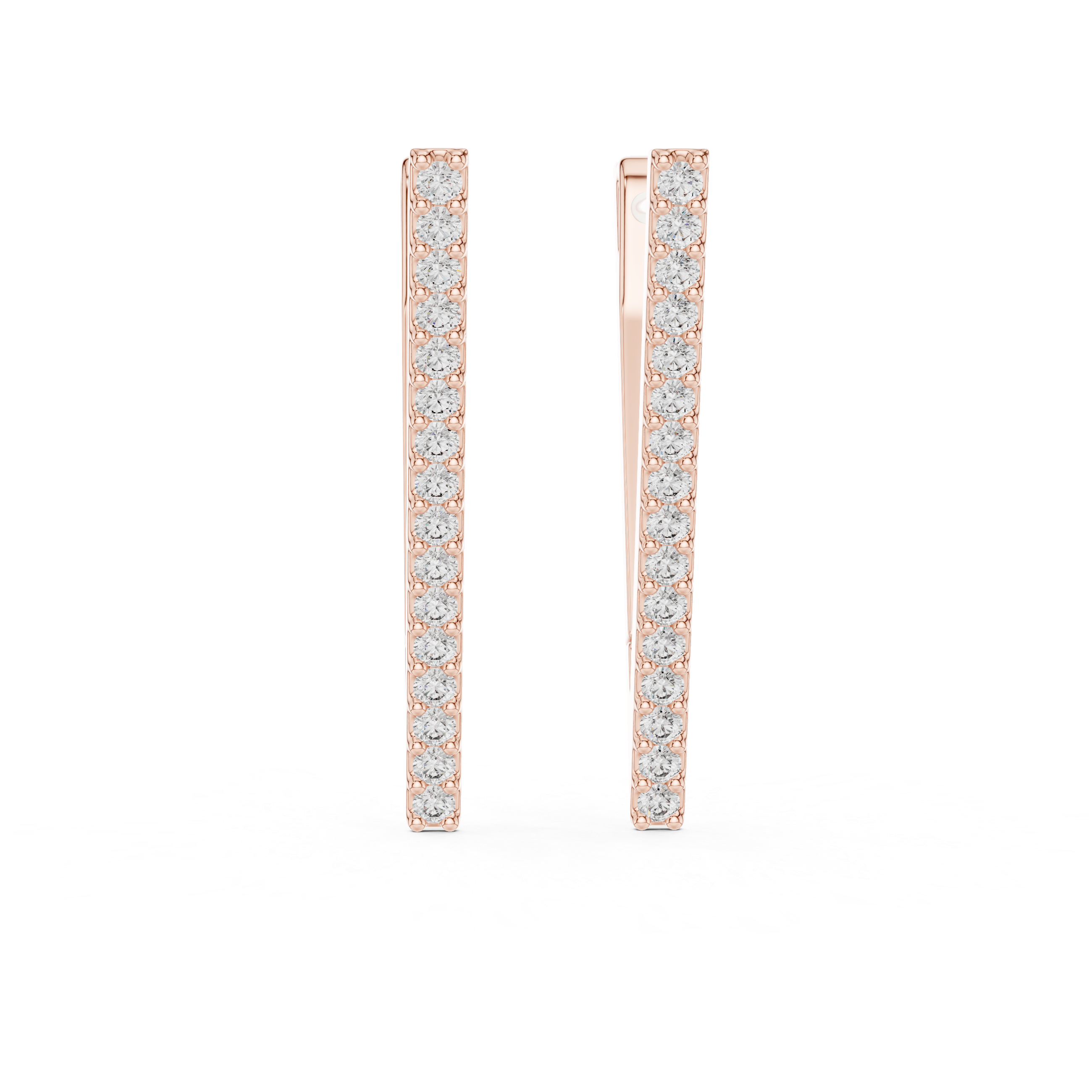 Rose gold hoop earrings with clear gemstones on a white background