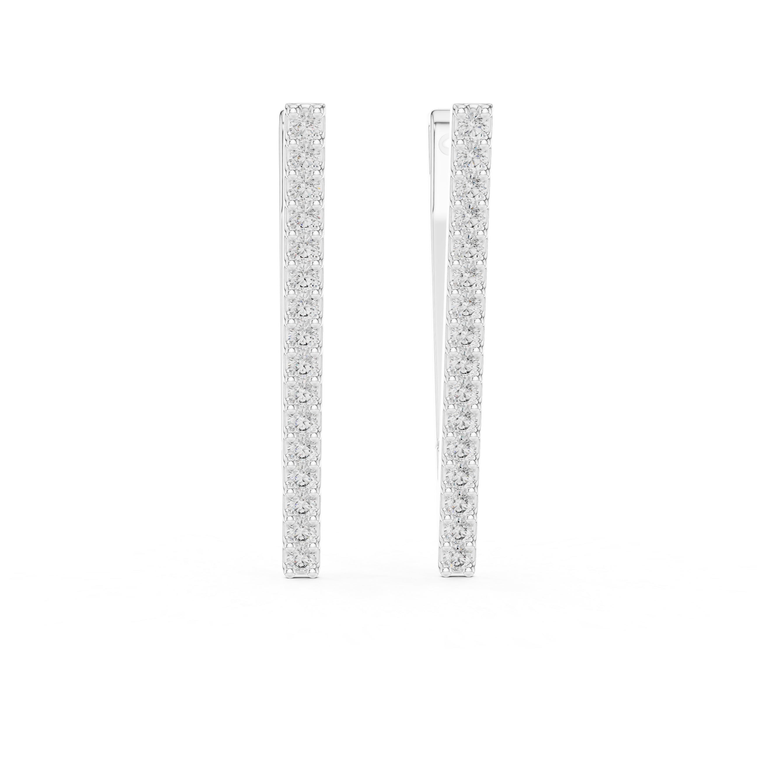 Pair of diamond hoop earrings on a white background