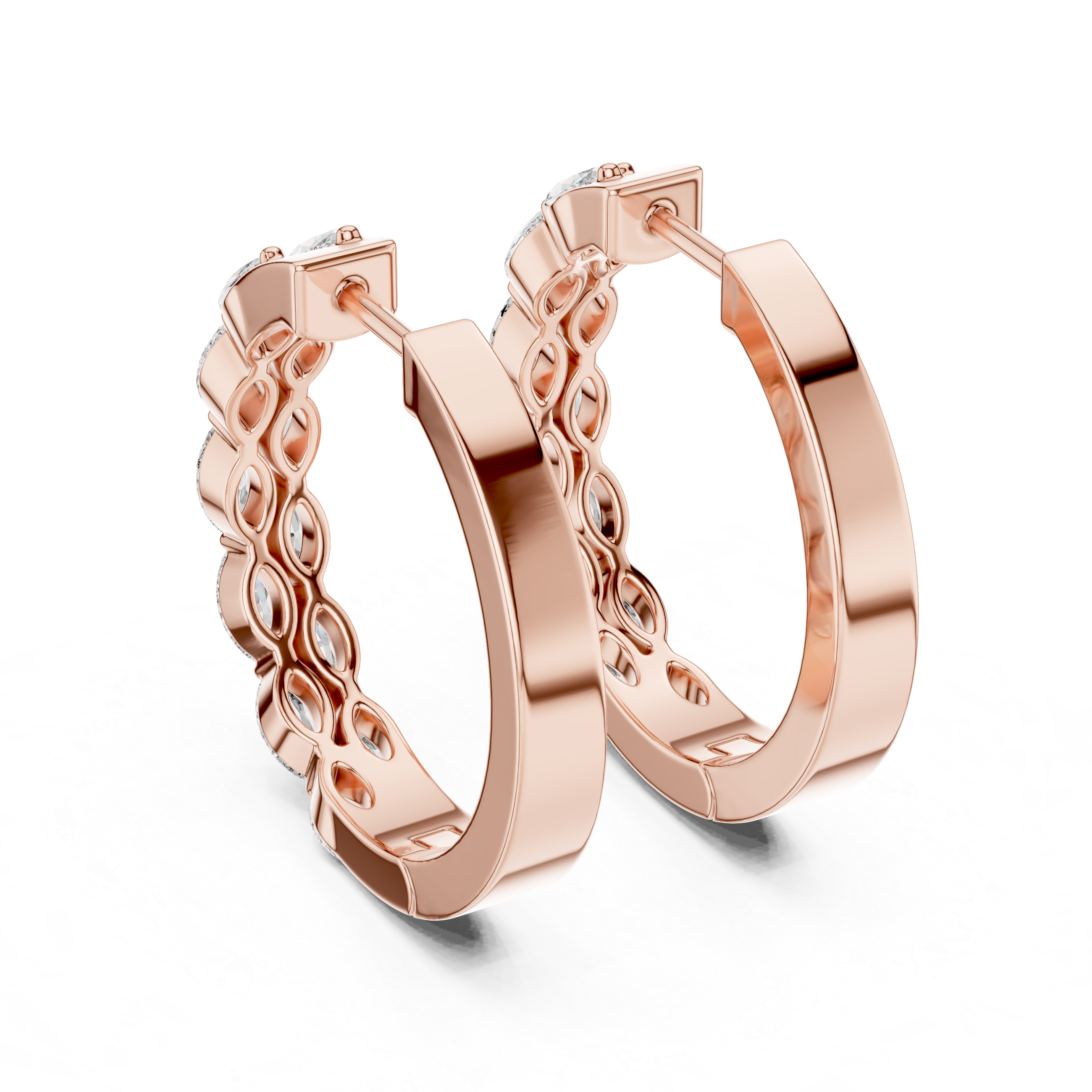 Rose gold hoop earrings with intricate design on a white background