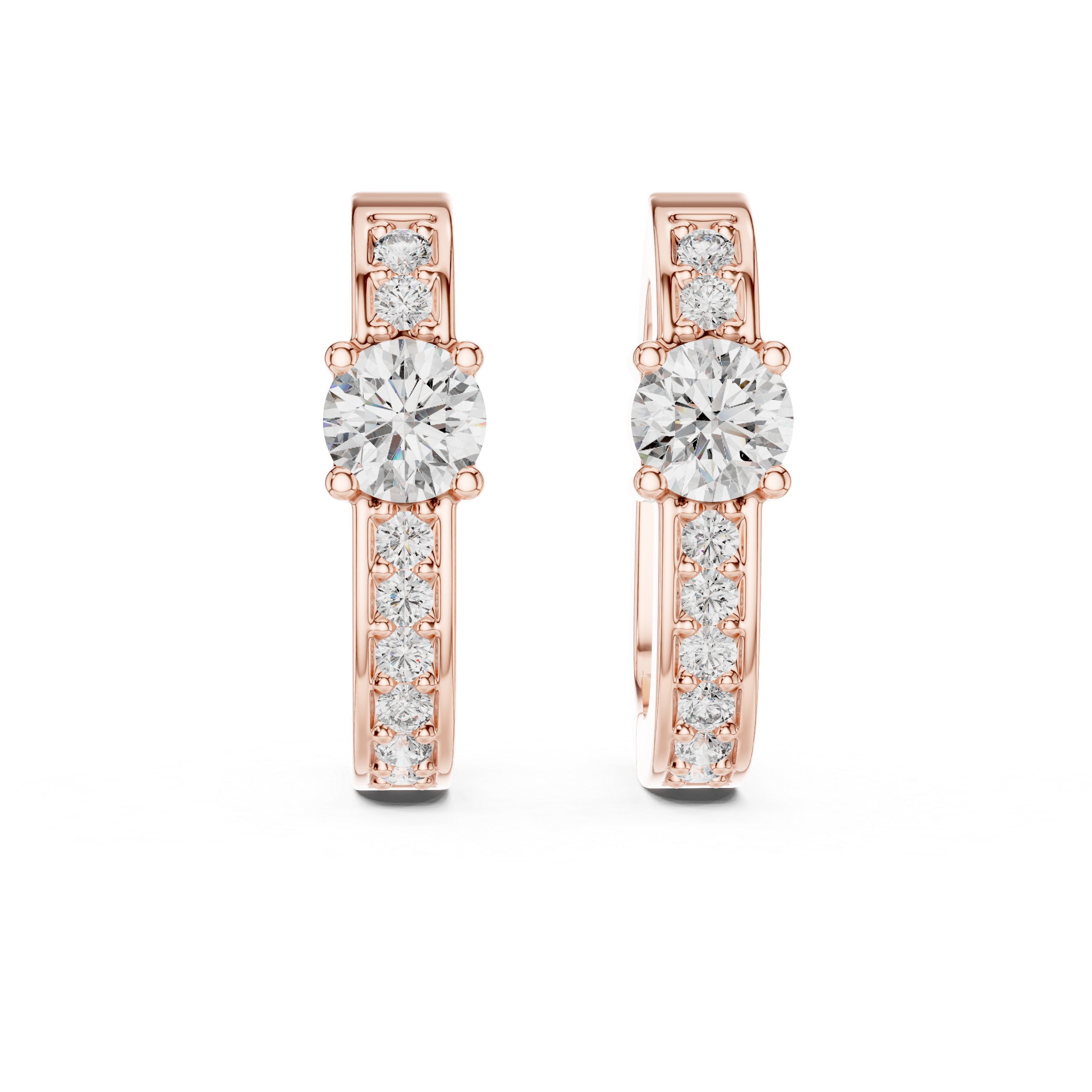 Rose gold earrings with clear gemstones on a white background
