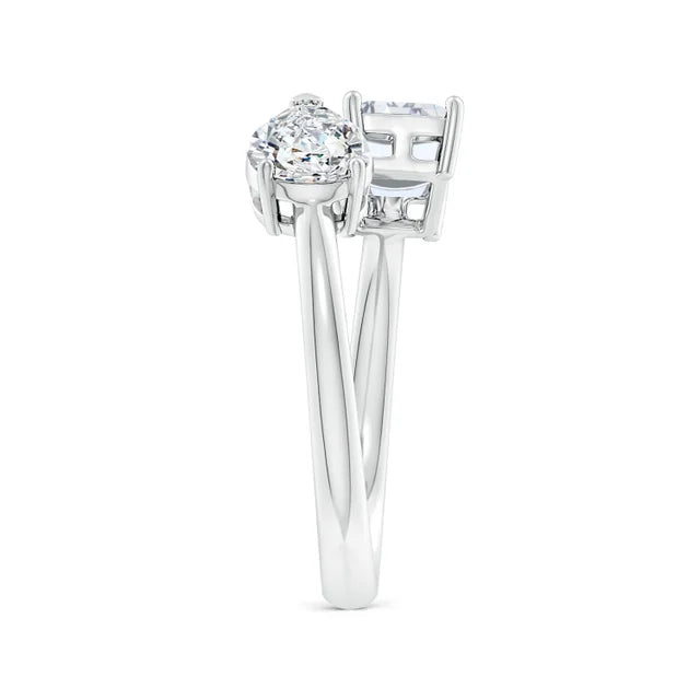 Diamond ring with a round center stone and square side stones on a white background