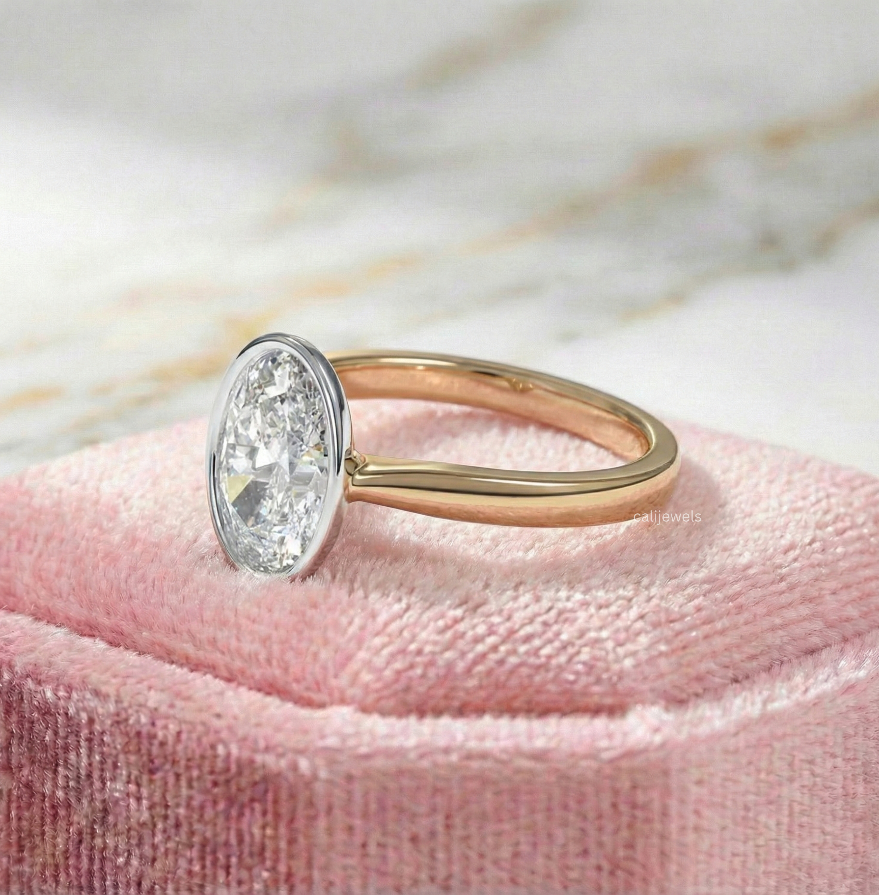 Two Tone Oval Cut Lab Grown Diamond Bezel Set Engagement Ring