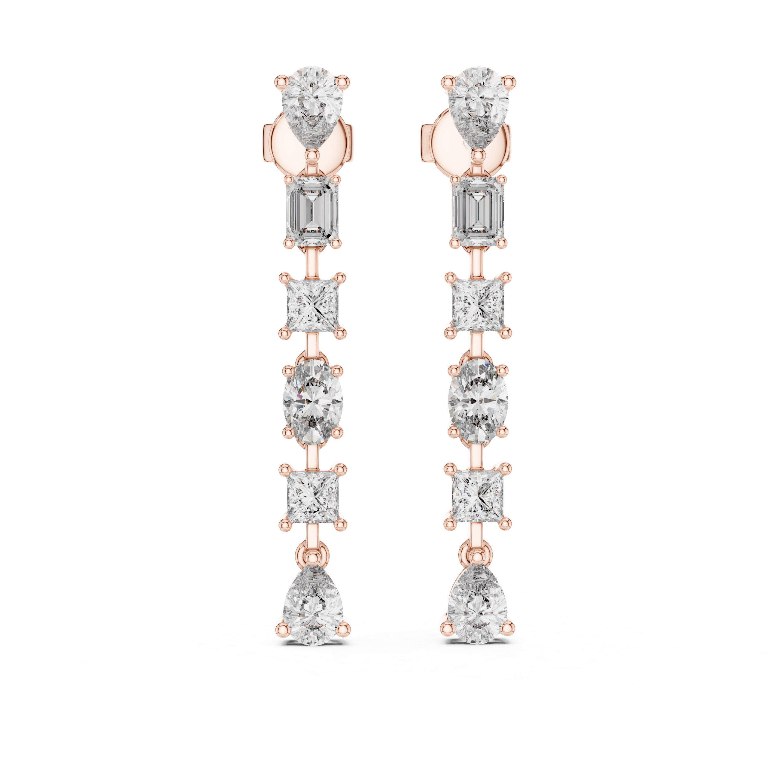 Rose gold and silver earrings on a white background