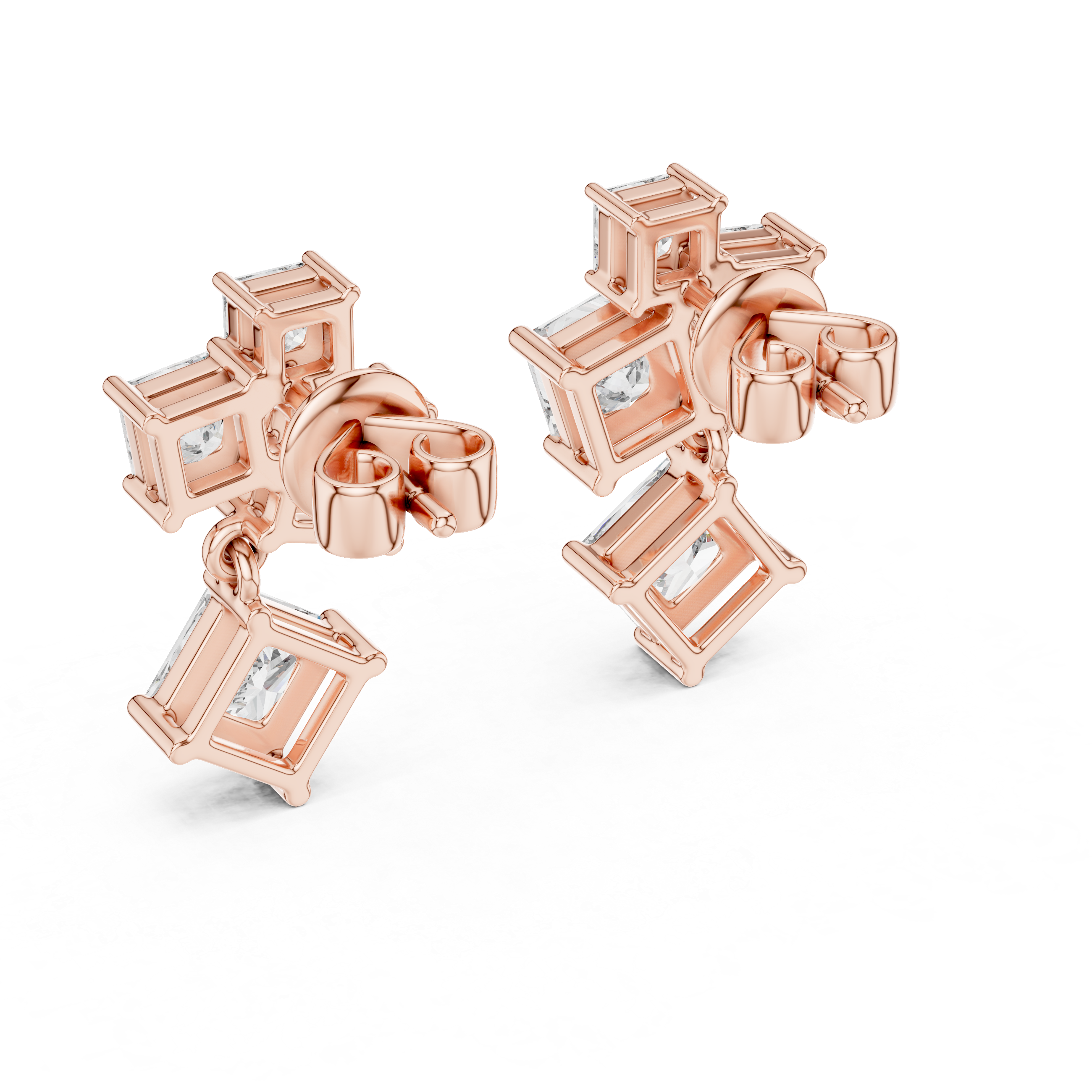 Rose gold earrings with clear gemstones on a white background