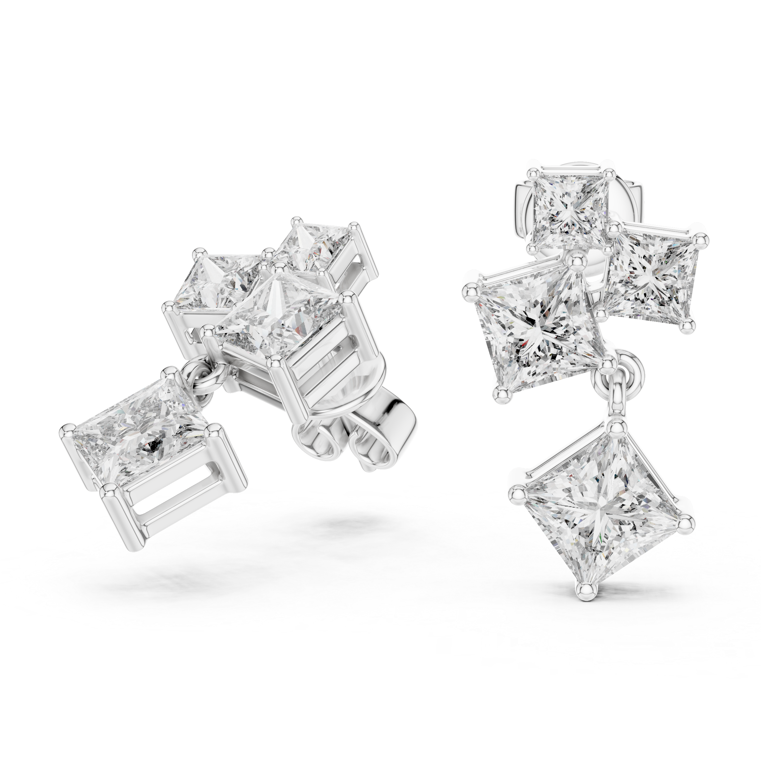 Diamond earrings with various cut diamonds on a white background