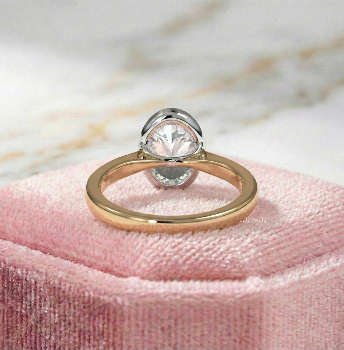 Two Tone Oval Cut Lab Grown Diamond Bezel Set Engagement Ring