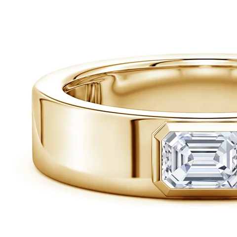 Gold ring with a diamond on a white background