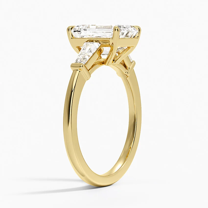 Gold ring with a diamond on a white background