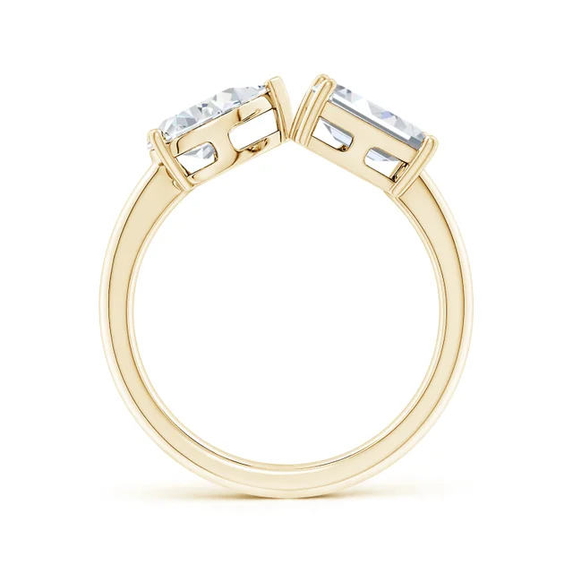 Gold ring with two rectangular gemstones on a white background