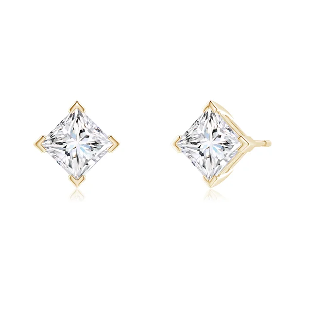 Pair of gold earrings with clear gemstones on a white background