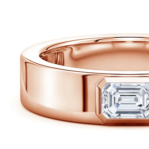 Rose gold ring with a diamond on a white background