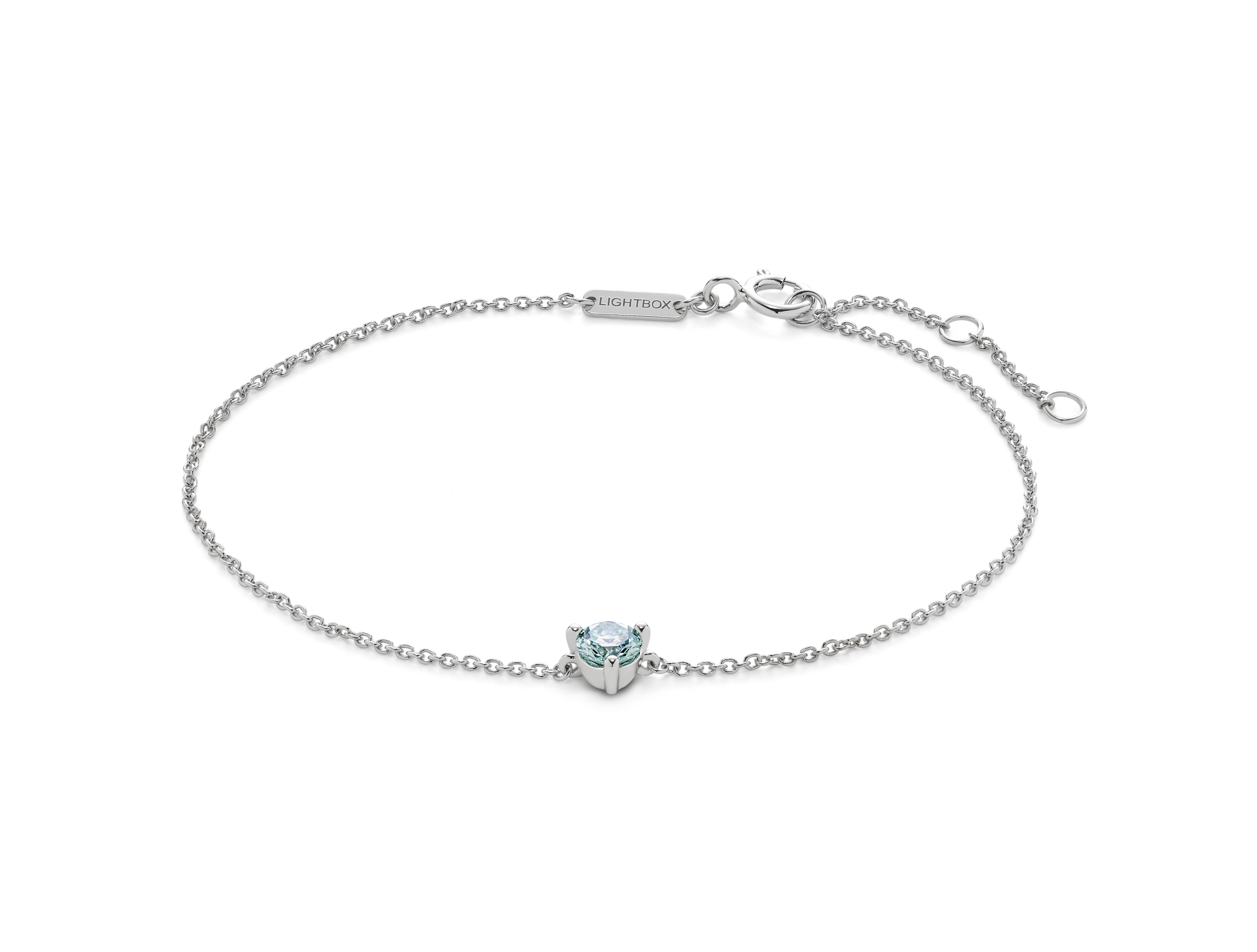 Front view of blue 0.25 carat round brilliant solitaire bracelet in 14k white gold
