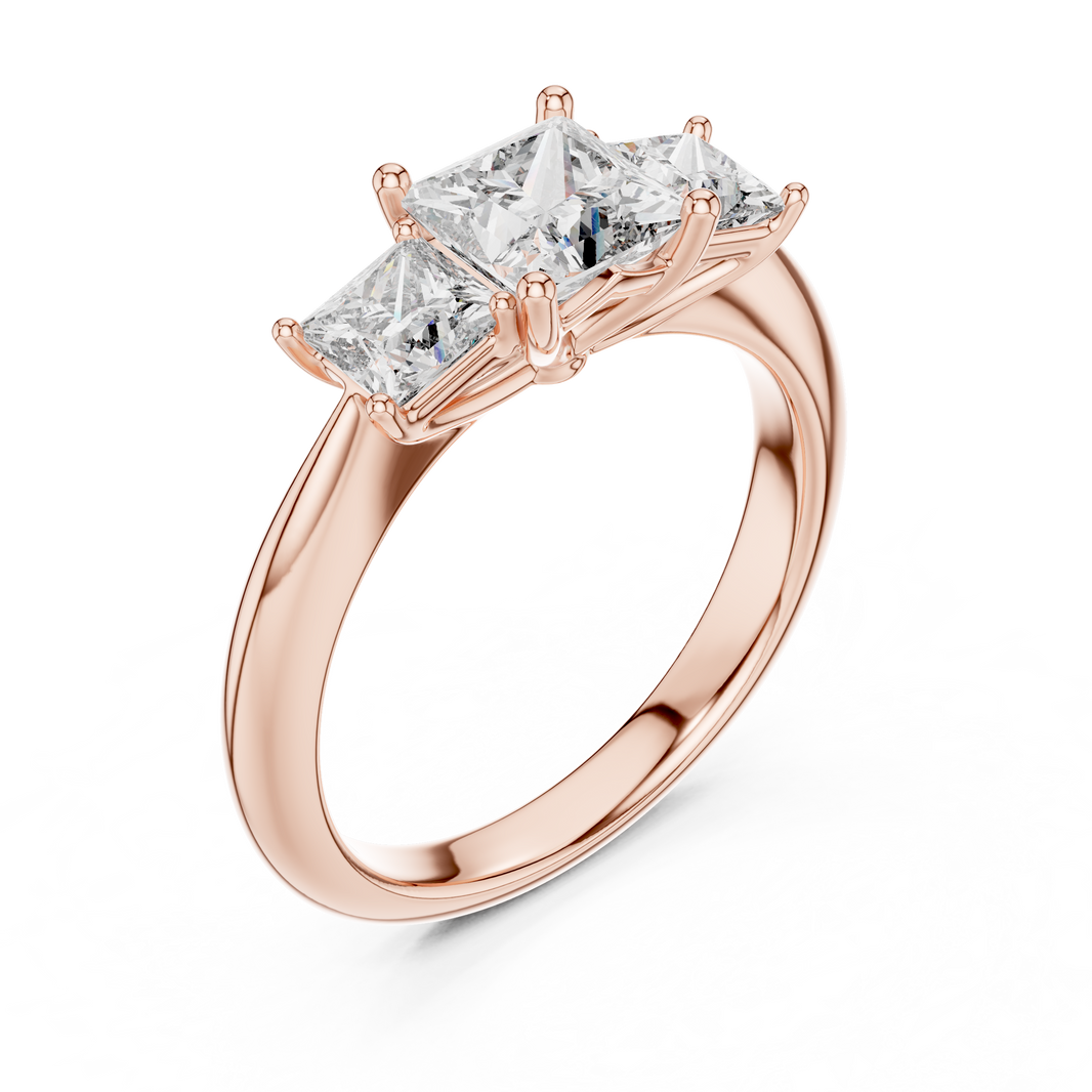 Rose gold ring with three-pronged diamond on a white background
