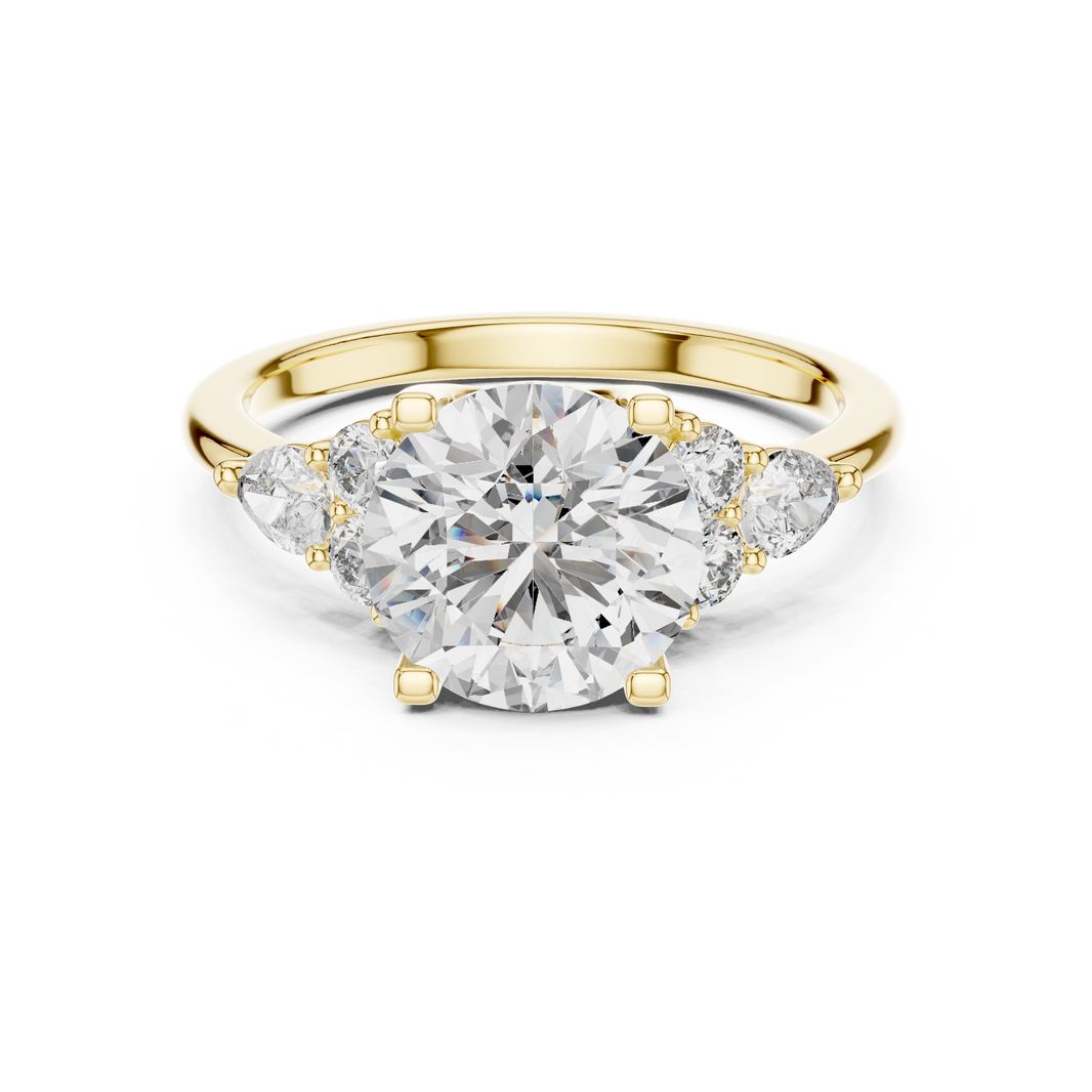 Gold ring with a large diamond and smaller diamonds on the sides against a white background